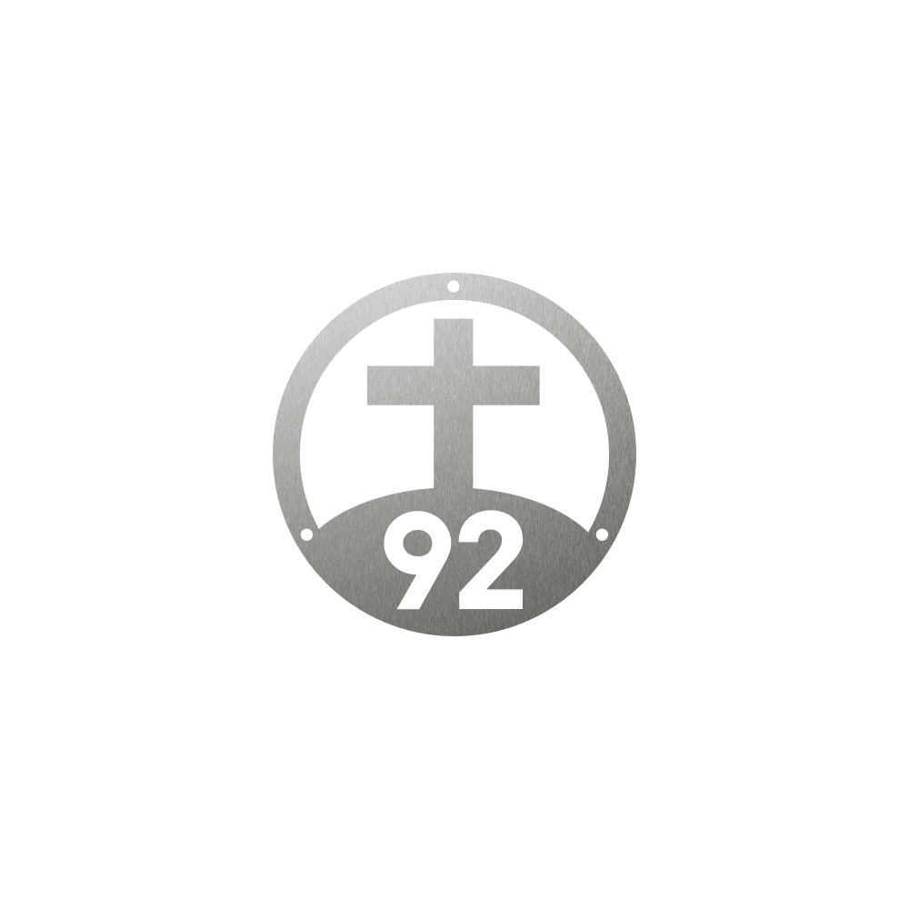 Circular steel house number with a Christian cross in the middle