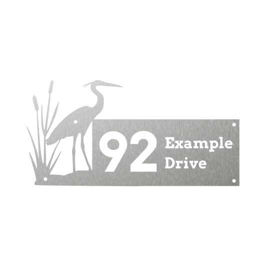Custom house number with heron bird and reeds silhouette protruding from the left side